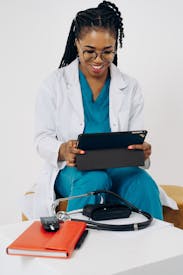 Doctor Using A Tablet For An Online Appointment