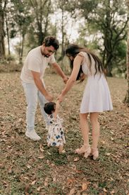 Happy Family Playing In Autumn Park