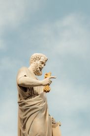 Statue Of St Peter Holding Keys Against Blue Sky