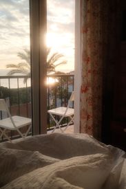 Serene Sunrise View From A Cozy Bedroom
