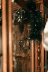 Cozy Holiday Wreath On Rustic Wooden Door