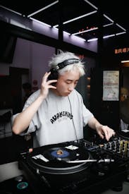 Dj Spinning Vinyl At Modern Indoor Club