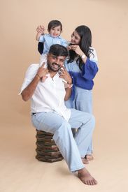 Happy Family Portrait With Toddler