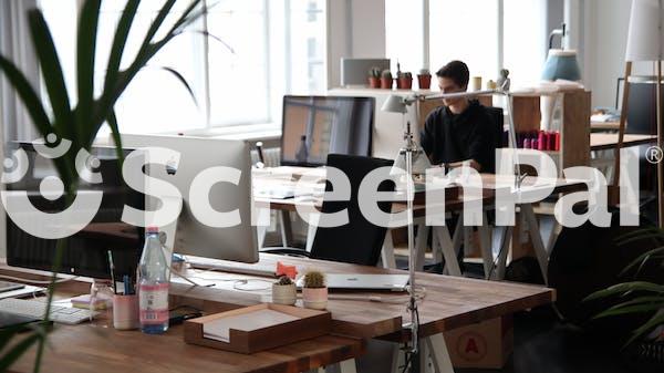 Man Sitting In Front Of Computer