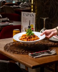 Delicious Pasta Dish In Cozy Restaurant Setting