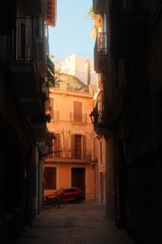 Charming Narrow Street With Sunlit Building