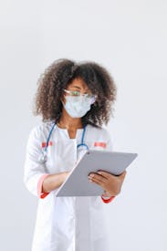 Female Doctor Using A Tablet