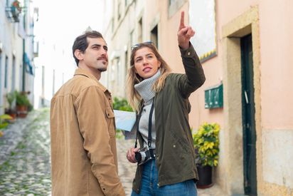 A Couple Standing On The Street