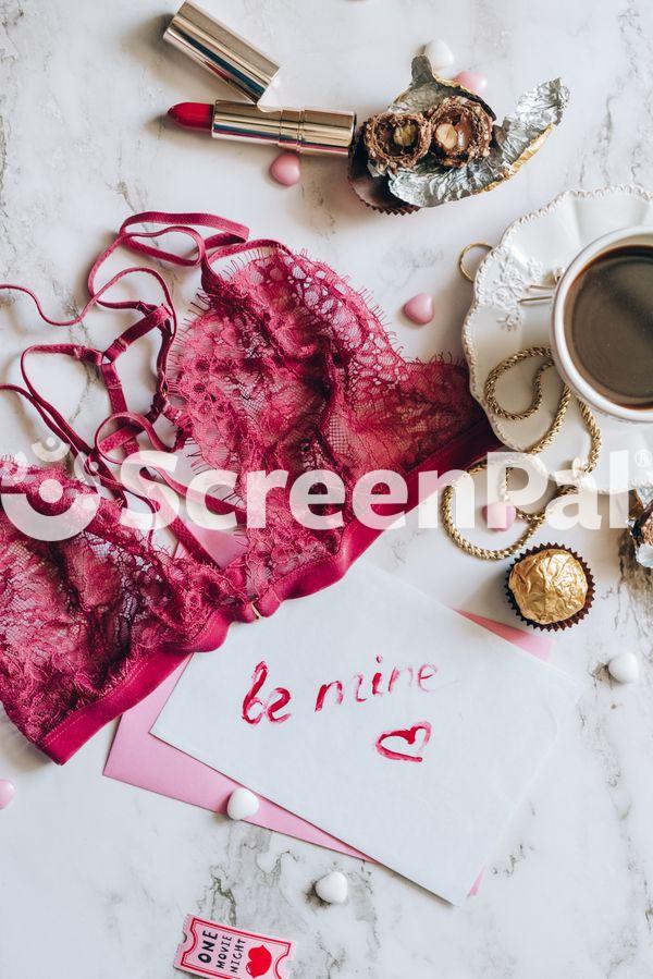 Be Mine Written On Card By Red Bra