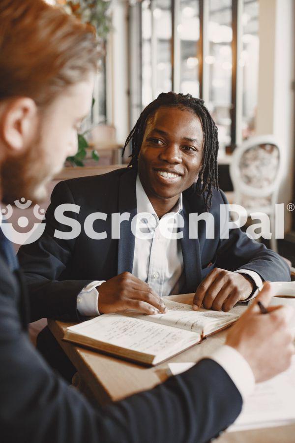 Portrait Of Businessmen Working In Office