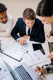 Group Of Men And Women Working Together