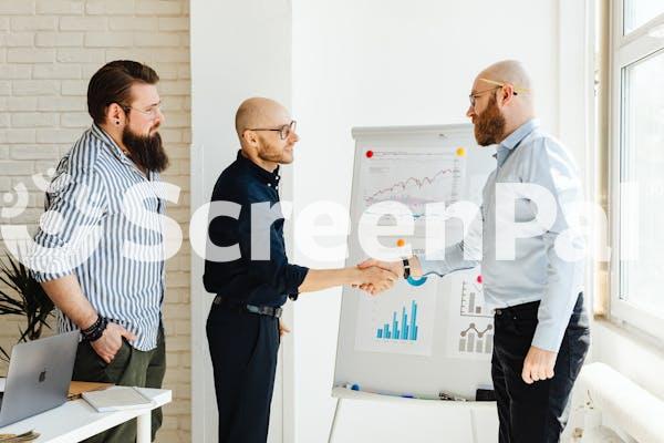 Men Making A Presentation In An Office