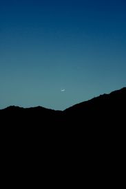 Silhouette Of Mountain Under Blue Sky During Night Time